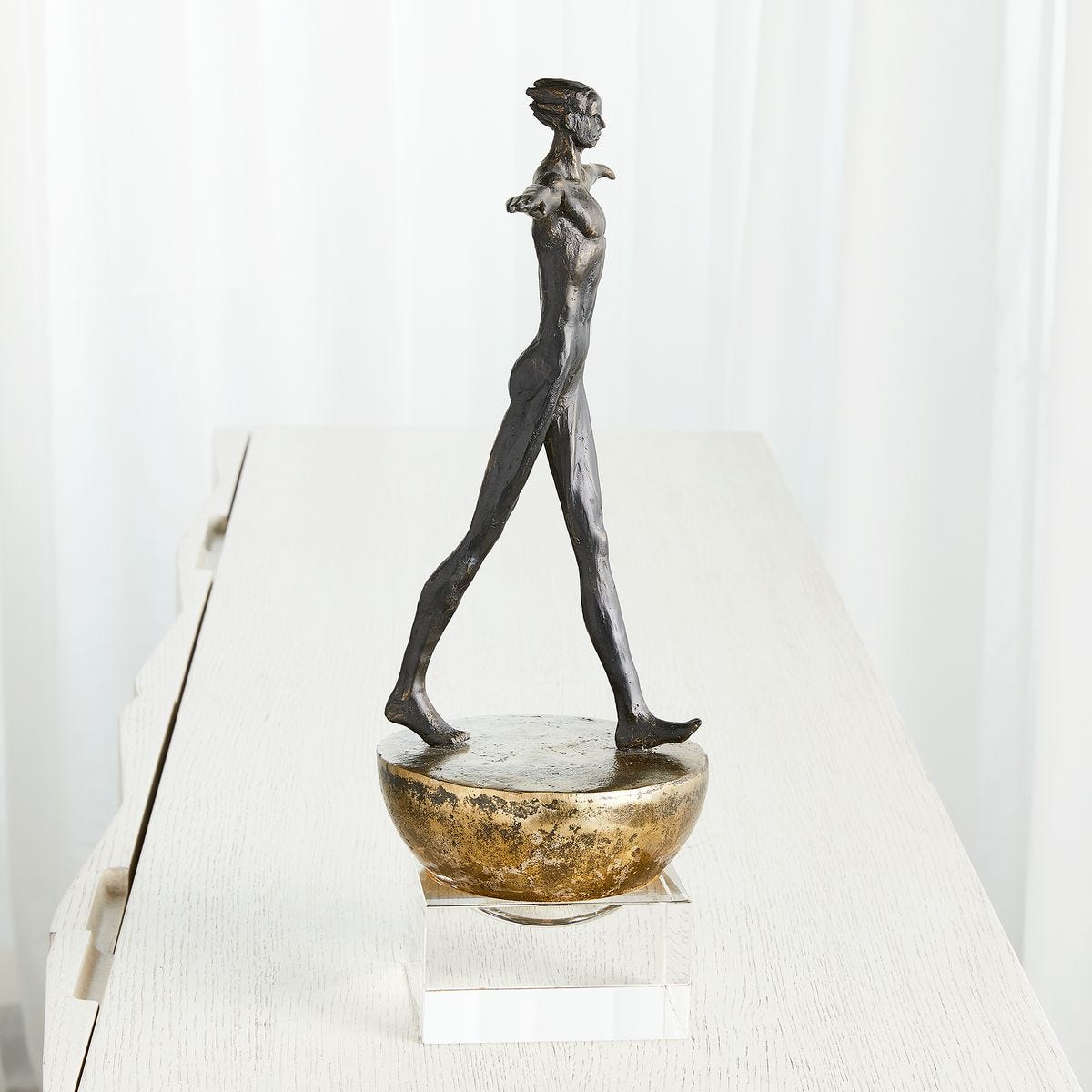 Man Finding Balance Sculpture